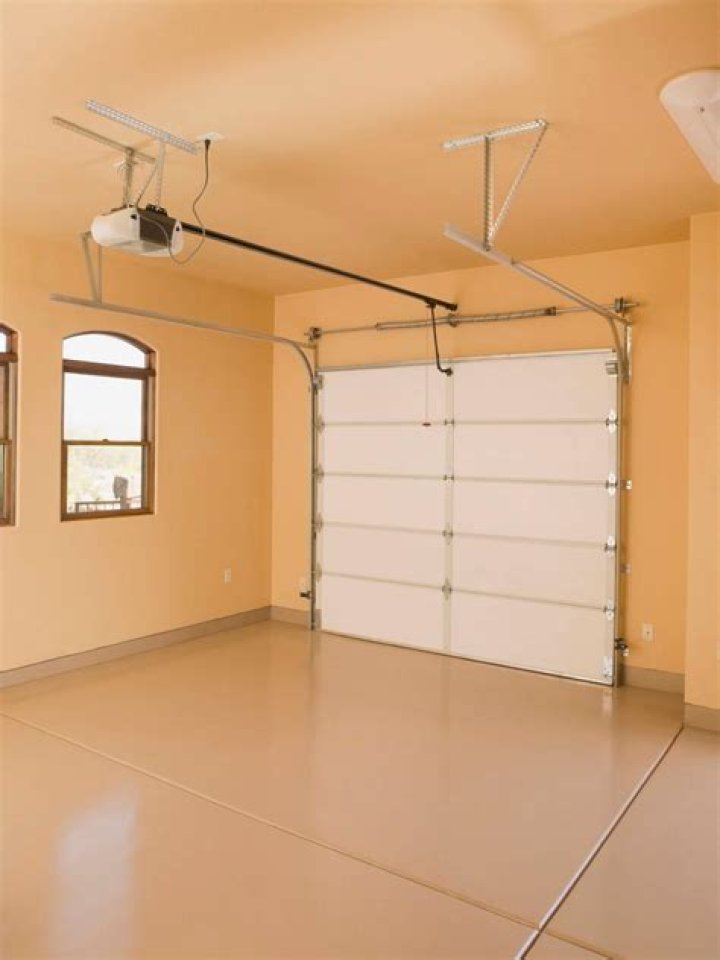Can a door open into a garage